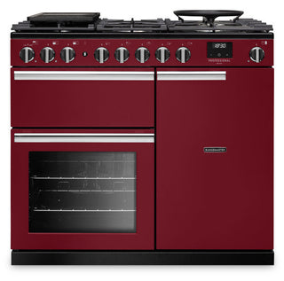A red and black Lancer Professional dual fuel range cooker with six control knobs, a digital display, and a black base, shown on a white background.