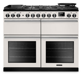 A freestanding gas range stove with a cream-colored body, black glass doors, black control knobs, and a black cast-iron cooktop with a built-in pan, shown against a plain white background.