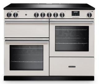 A cream-colored freestanding range cooker with black glass cooktop, black control panel, and black base trim, shown on a plain white background.